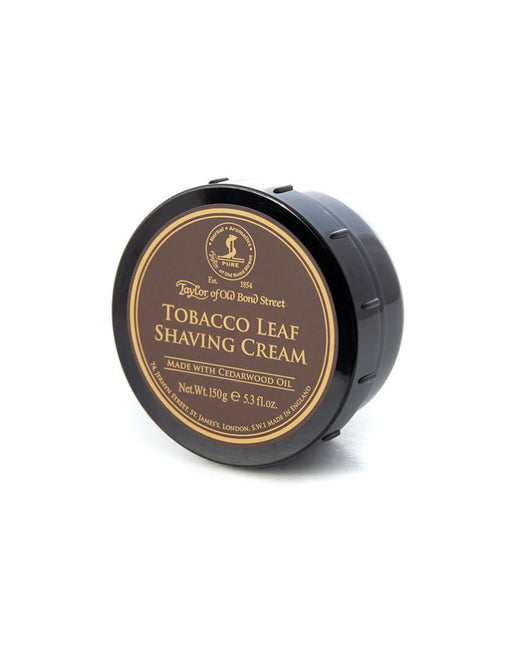 A round container of Taylor of Old Bond Street Tobacco Leaf Shaving Cream with a black lid and a label on the front.