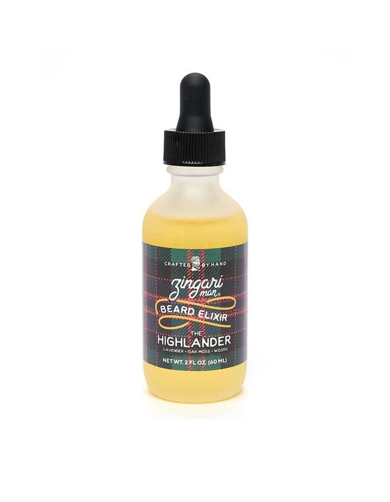 The Highlander Beard Elixir in a 2 oz frosted glass bottle with natural oils and a fresh, herbal-woody scent inspired by Scottish Highlands.