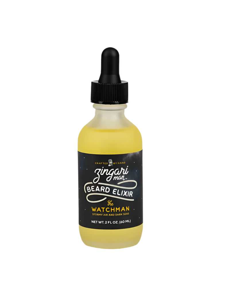 The Watchman Beard Elixir in a white frosted glass dropper bottle with nourishing oils and a scent inspired by stormy sea air and aged wood.