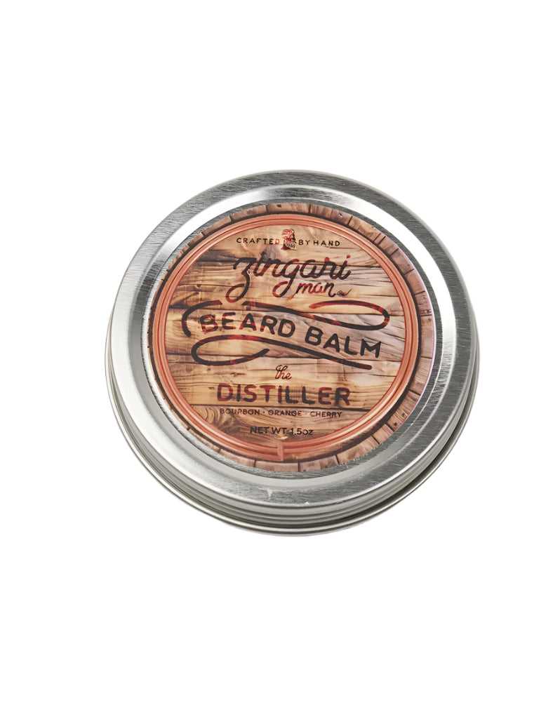 Beard balm container with wooden design and metallic lid on a white. Distiller beard balm tin with bourbon citrus scent