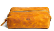 handcrafted nokona dopp kit in generation leather with navy waterproof liner and custom monogram option