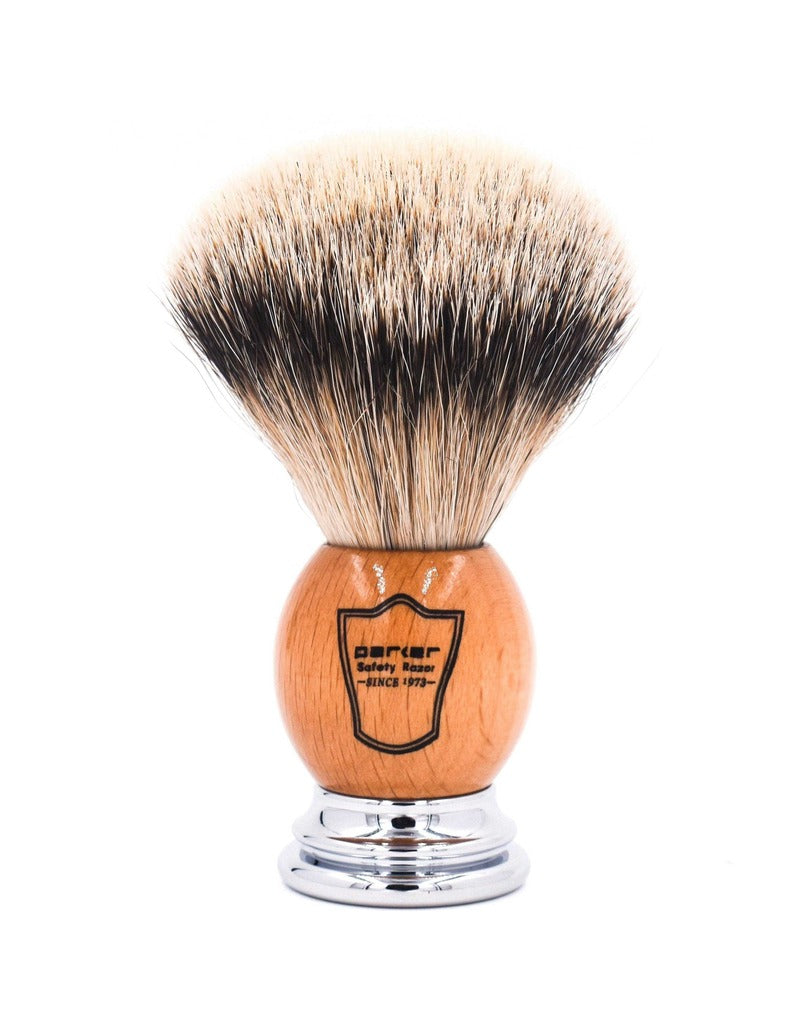 Parker silver tip badger shaving brush with a light wood handle, chrome base and Parker shield logo